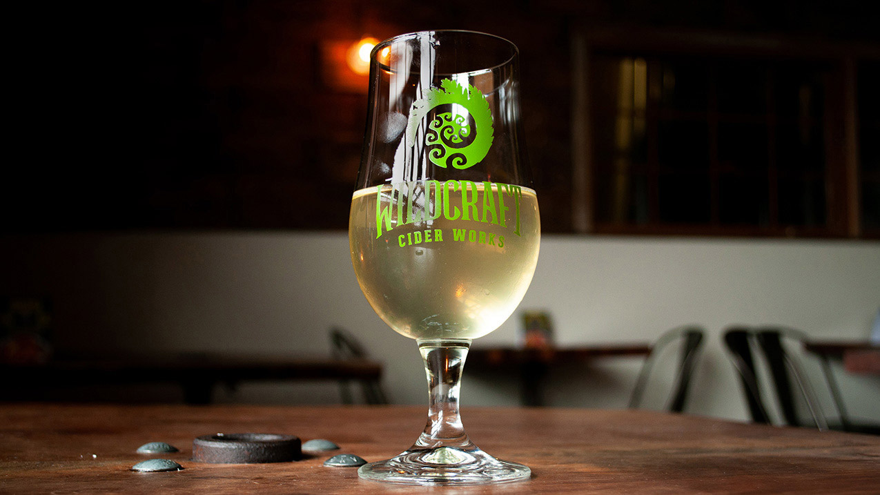 Photo of a glass of wildcraft cider.